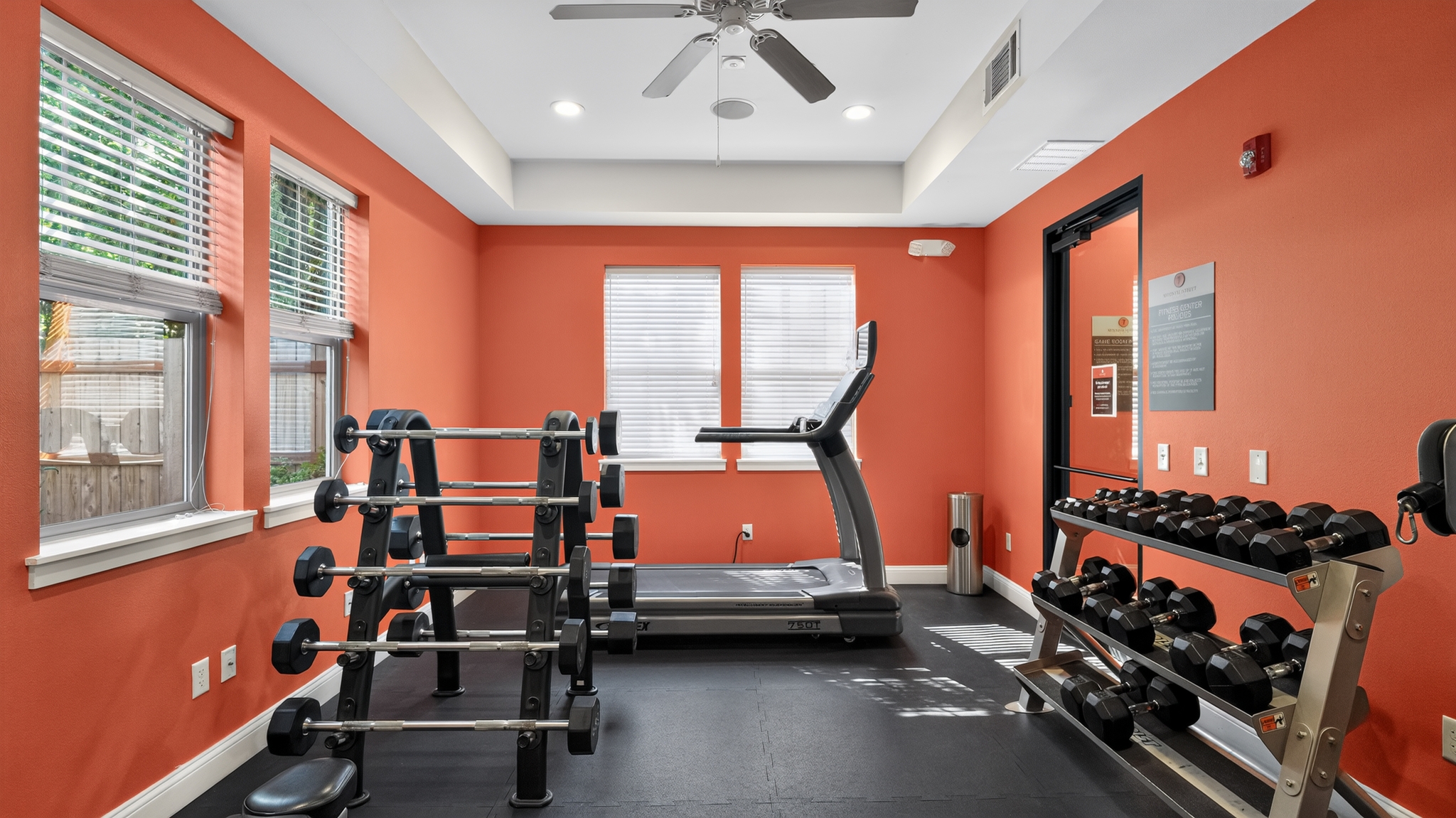 Fitness center with free weights and treadmill at 7th Street Station